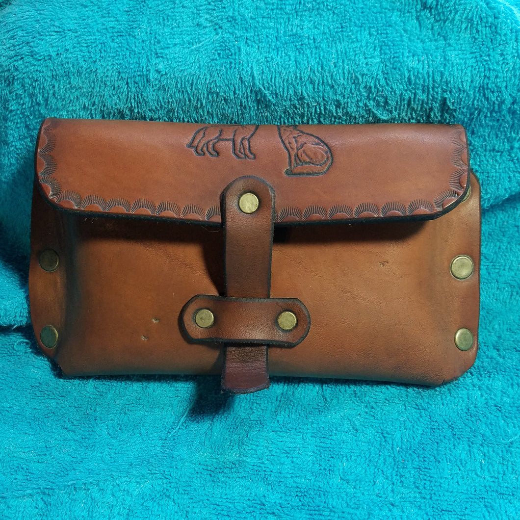 Pouch with engraved wolves