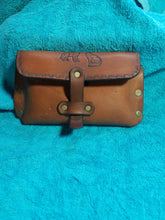 Pouch with engraved wolves