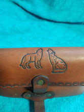 Pouch with engraved wolves